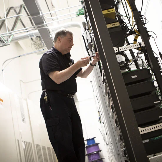 Technician performing annual DAS/BDA maintenance