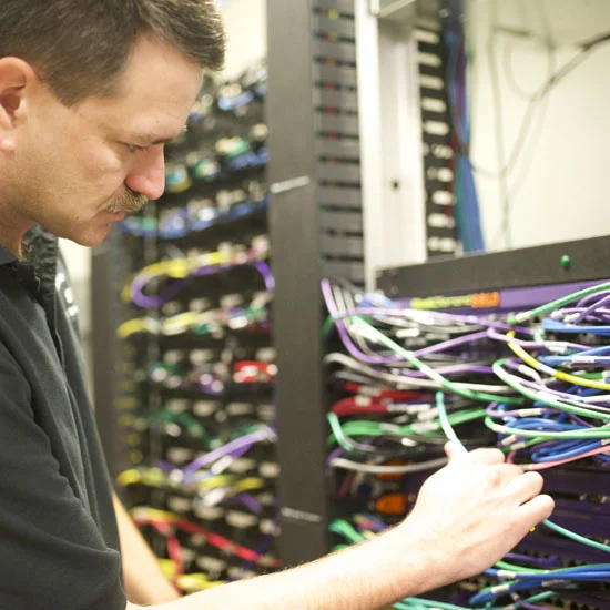 Technician implementing DAS/BDA installation